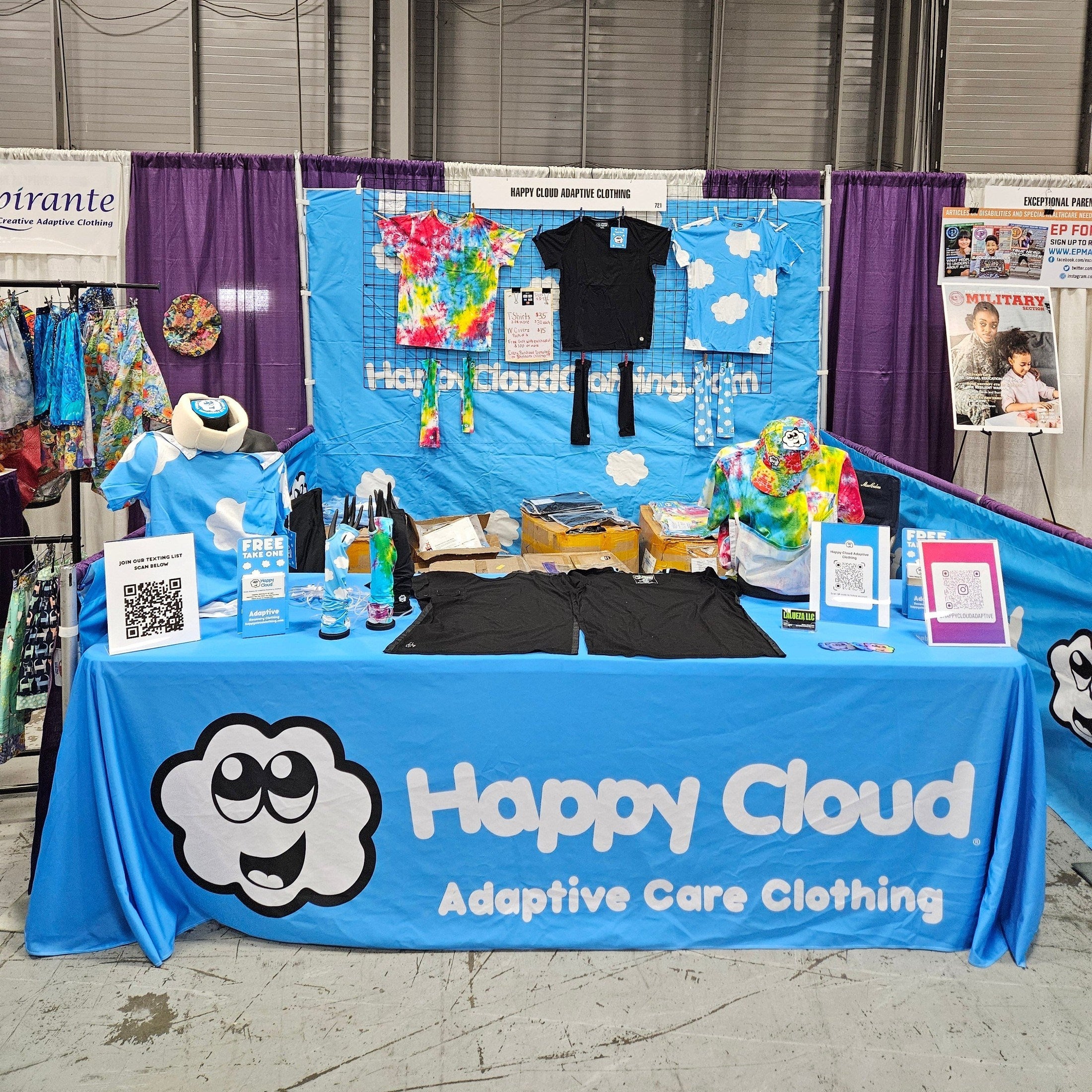 Display of adaptive care clothing with 'Happy Cloud' branding on a table.